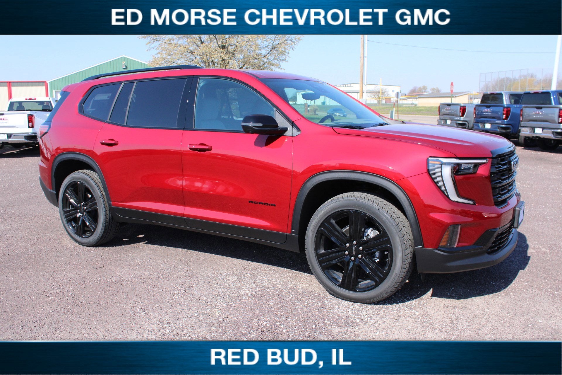 2026 GMC Acadia Elevation in Volcanic Red Tintcoat — front three-quarter view