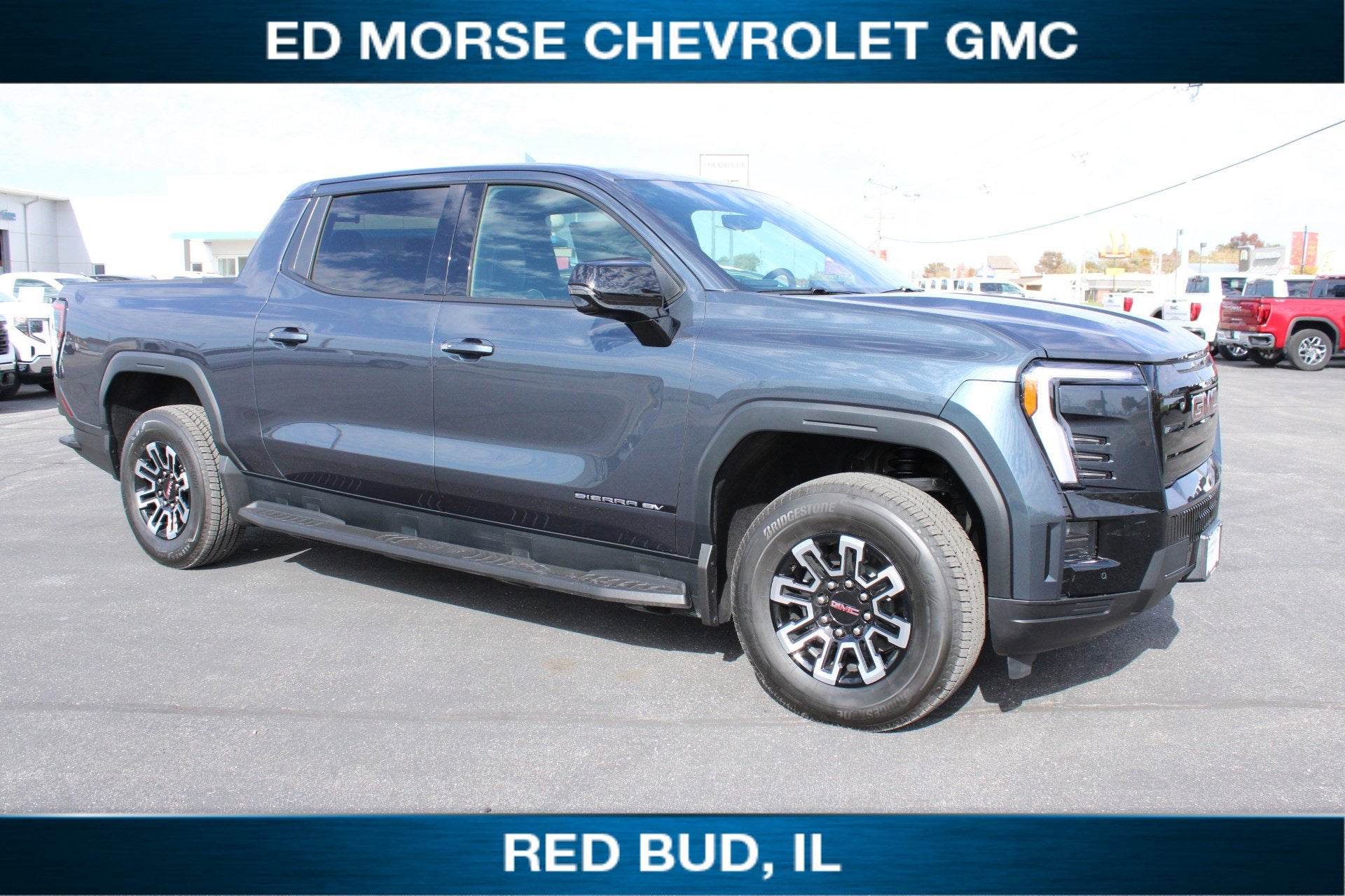 2026 GMC Sierra EV Elevation Extended Range in Deep Ocean Metallic — front three-quarter view