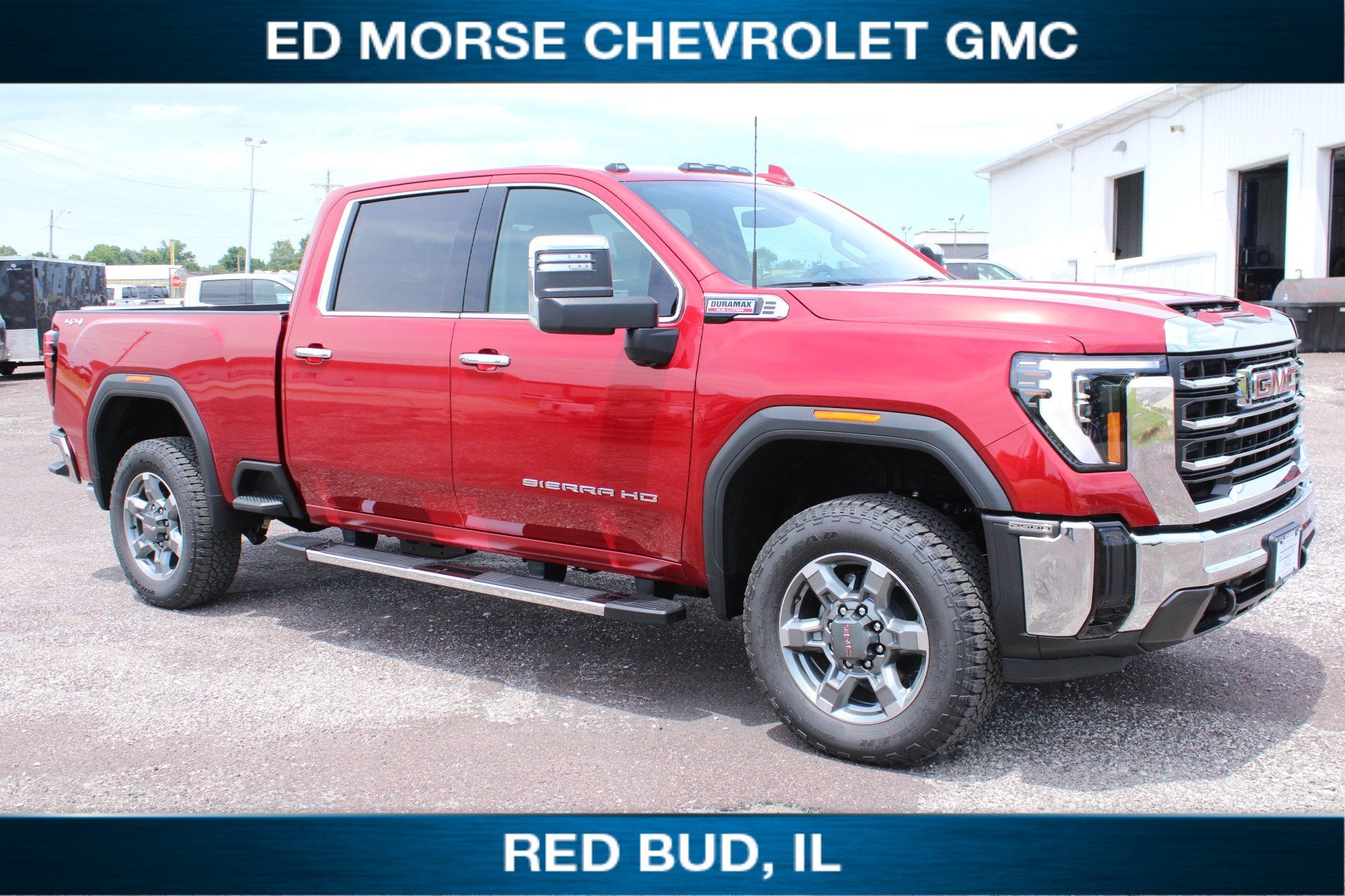 2026 GMC Sierra 2500 HD SLT in Volcanic Red Tintcoat — front three-quarter view